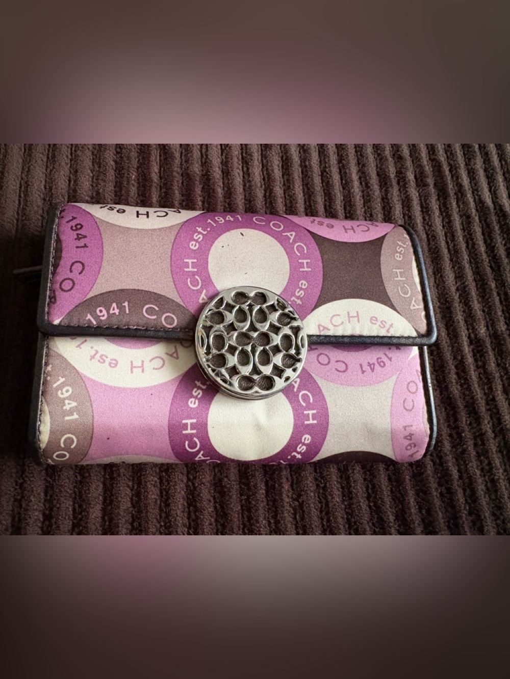 Coach Purple and Pink Signature Logo Wallet with Silver Medallion Closer.